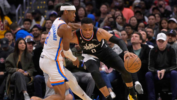 Mar 23, 2023; Los Angeles, California, USA; Los Angeles Clippers guard Russell Westbrook (0) drives past Oklahoma City Thunder guard Shai Gilgeous-Alexander (2) in the second half at Crypto.com Arena.